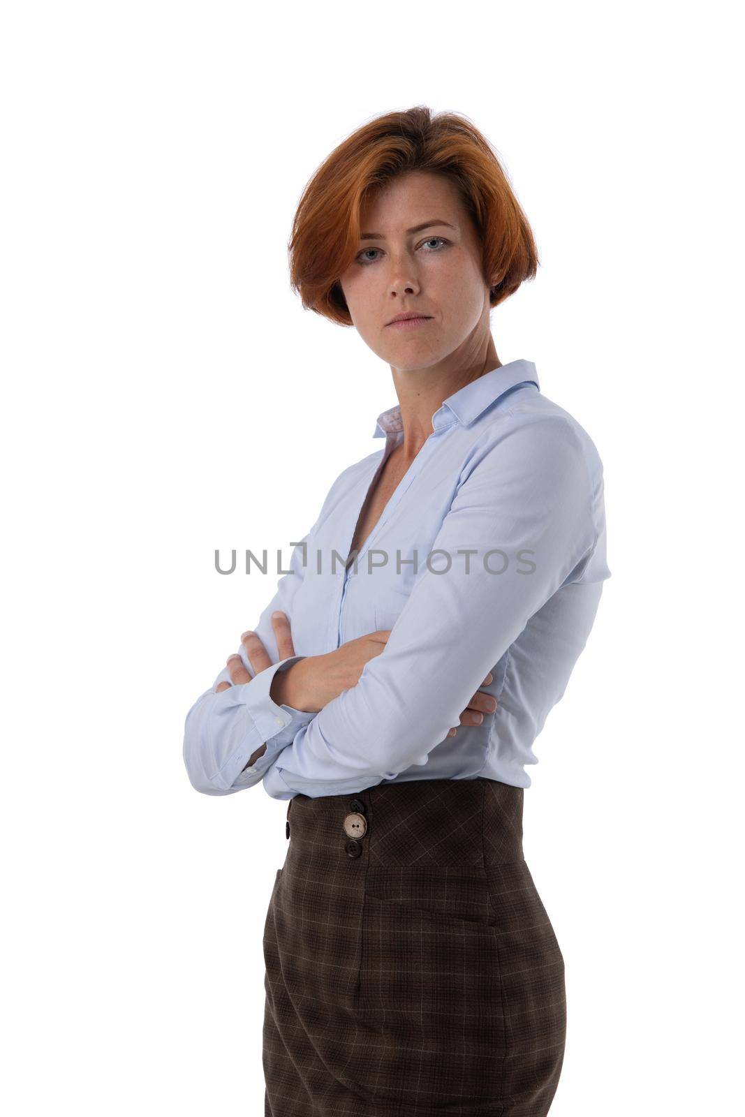 Portrait of young business woman standing with arms folded studio isolated on white background, business people