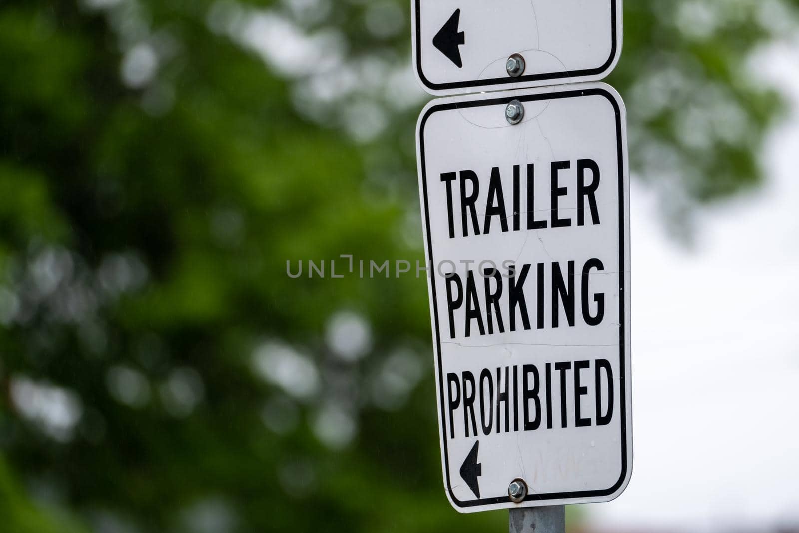 Close-up of a metal sign that says "Trailer Parking Prohibited".