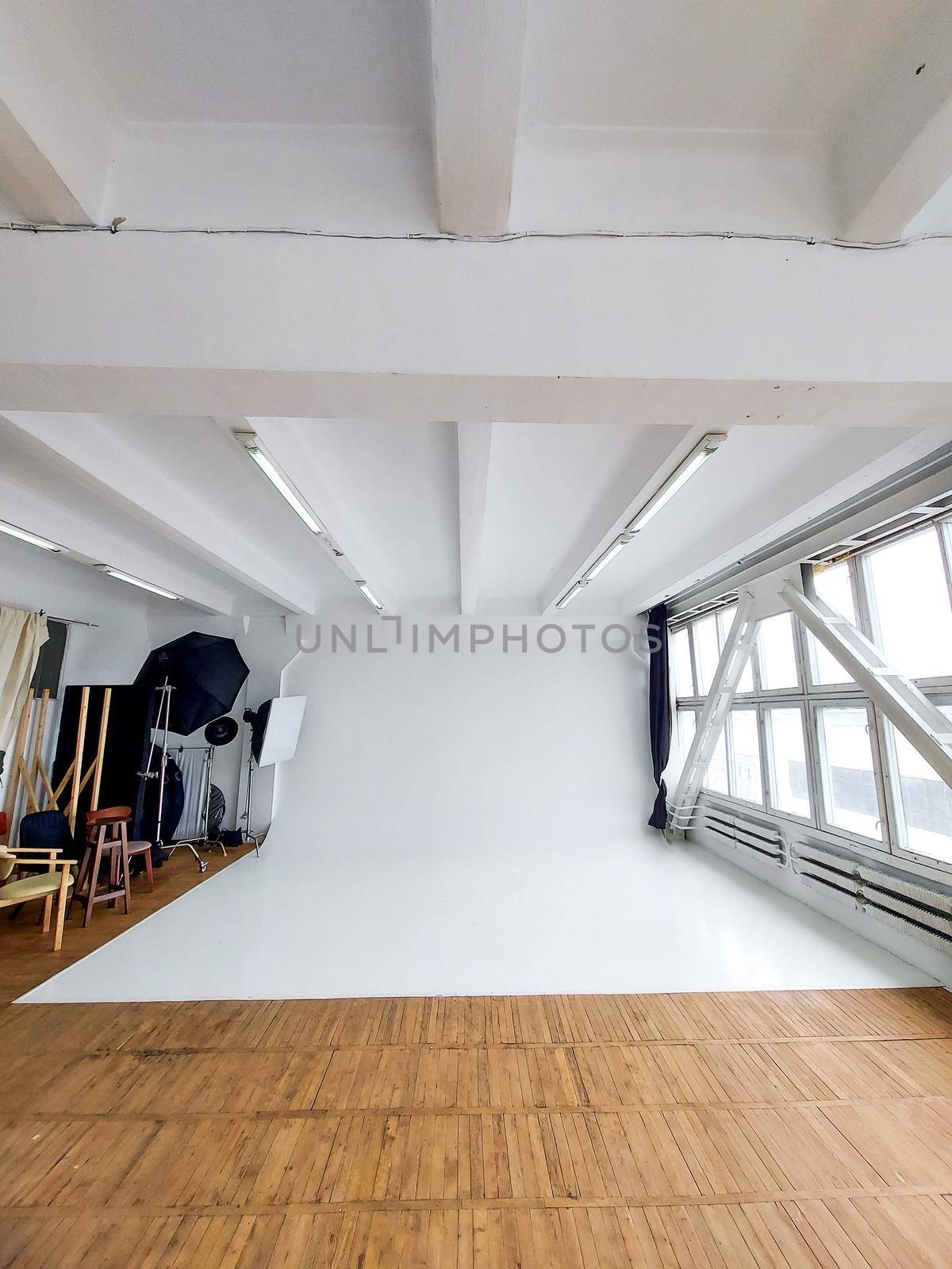 Large daylight photo studio with cyclorama and large panoramic windows. by vovsht