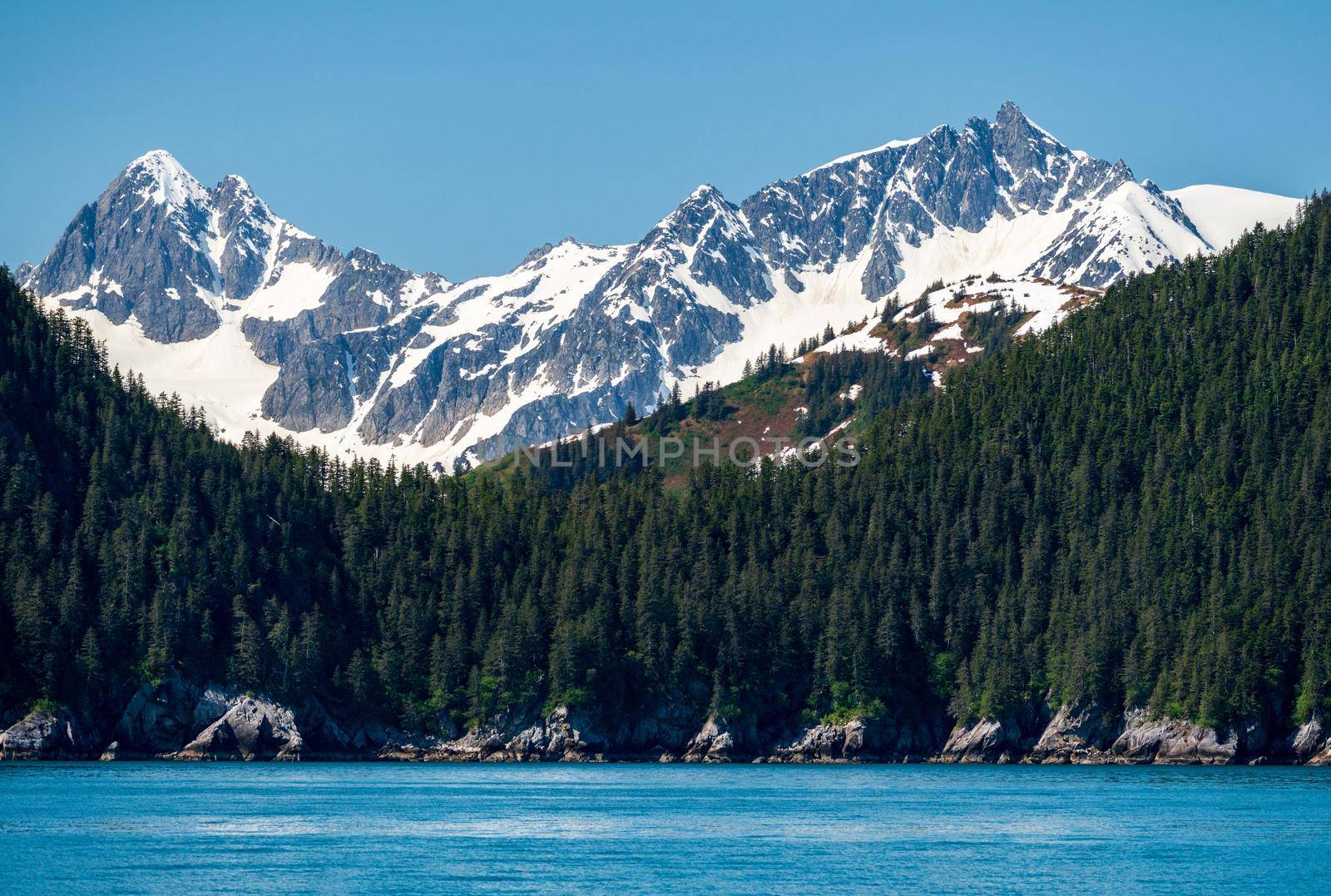 Snow covered peak of the mountain overlooking the port of Seward in Alaska