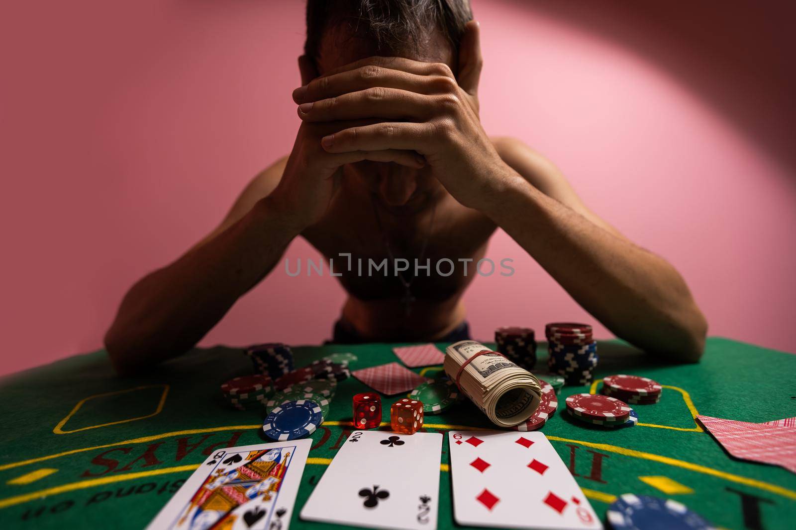 Devastated gambler man losing a lot of money playing poker in casino, gambling addiction. Divorce, loss, ruin, debt, ludopata concept. by Andelov13