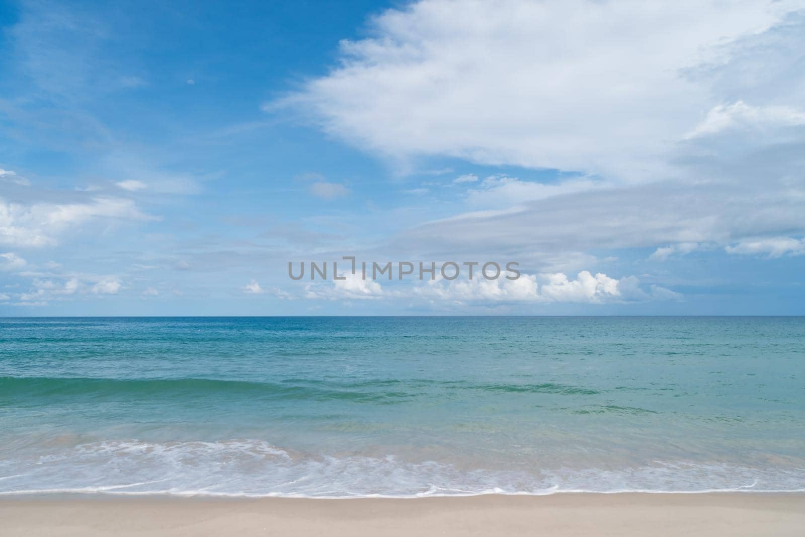 Tropical nature clean beach and white sand in summer with sun light blue sky.