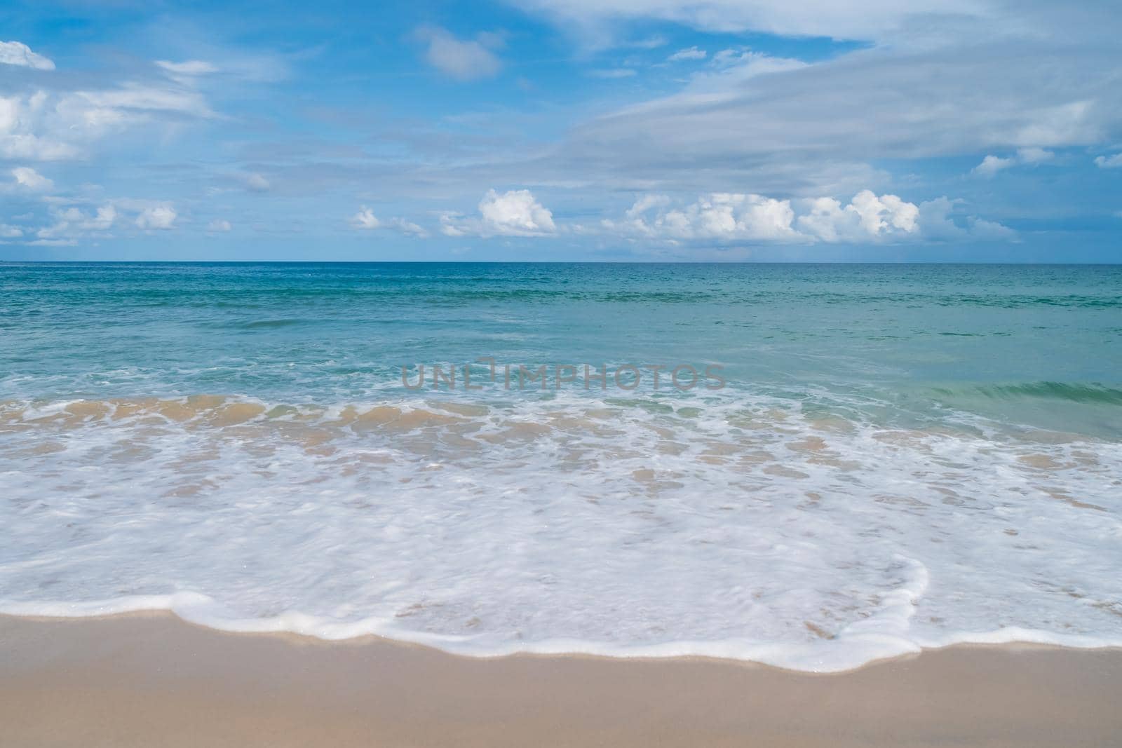 Tropical nature clean beach and white sand in summer with sun light blue sky and bokeh. by Suwant