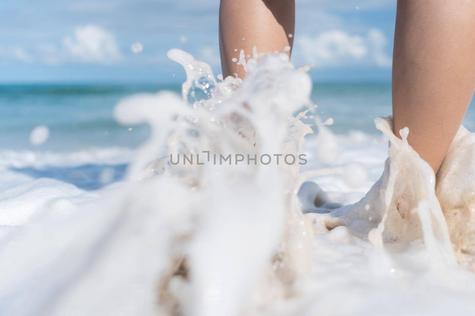 Summer vacation concept barefoot on sand at beach with copyspace. by Suwant