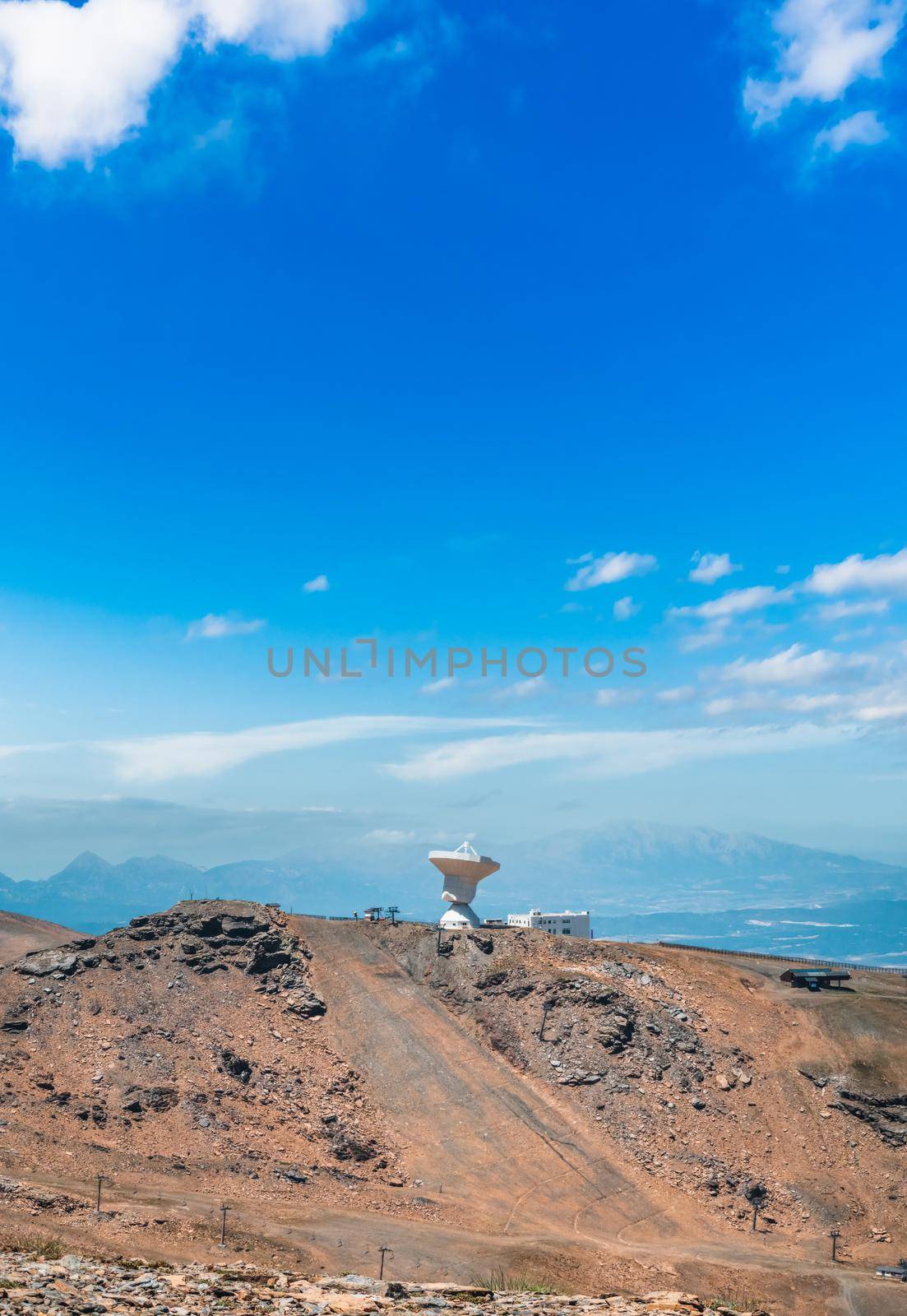 Astronomical observatory in Sierra Nevada under blue sky by FerradalFCG