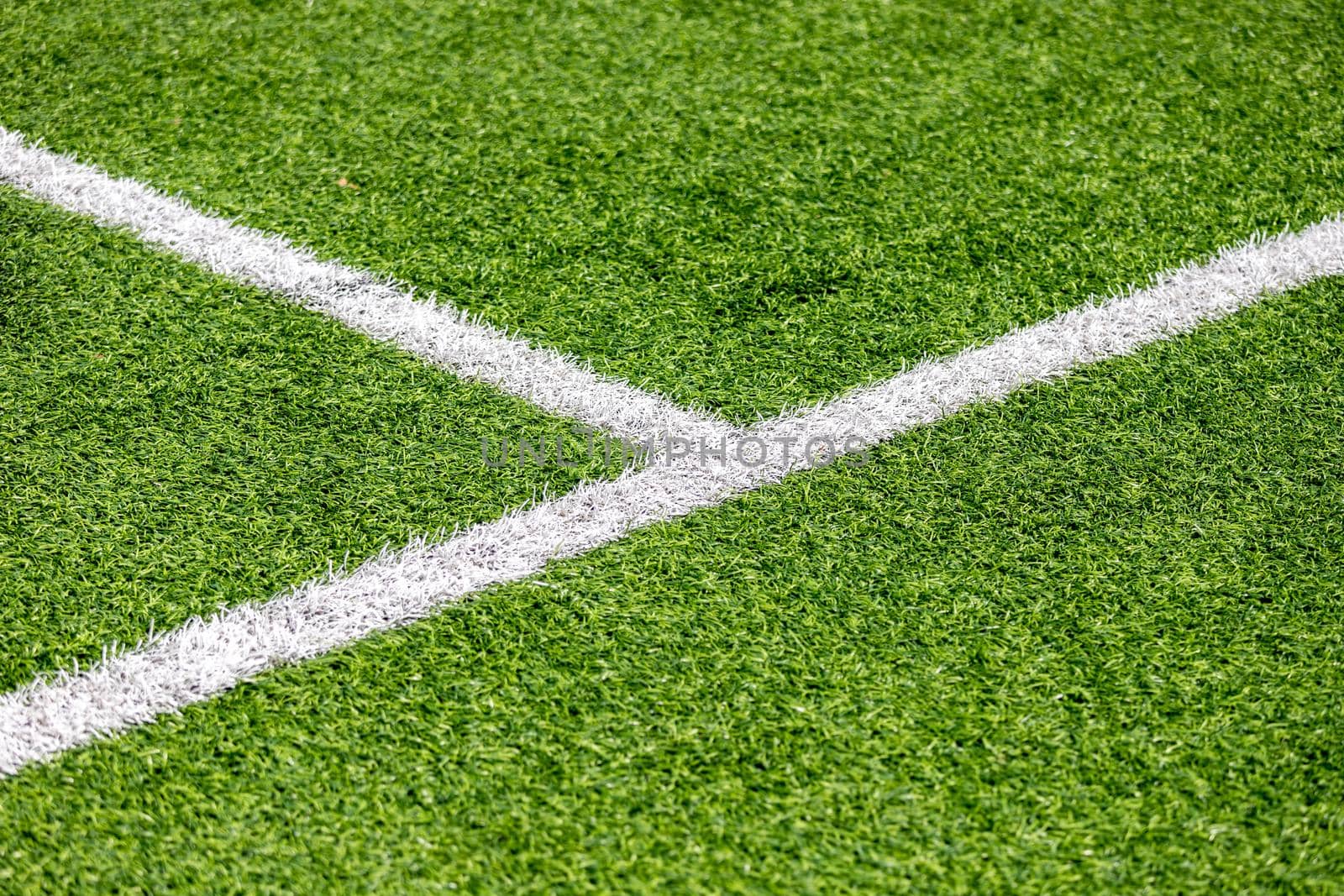 marking lines on a green football field by bySergPo