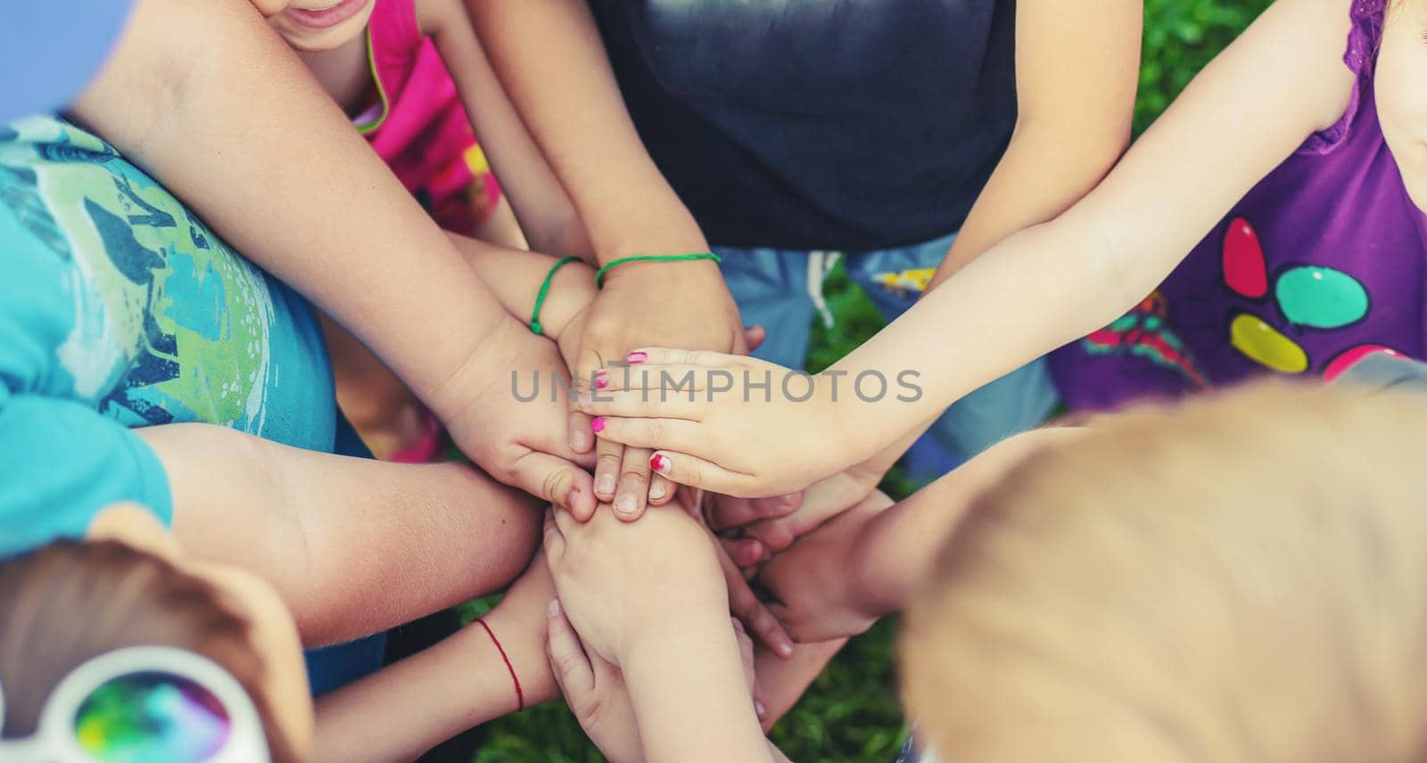 Children's hands together, street games. Selective focus. by yanadjana