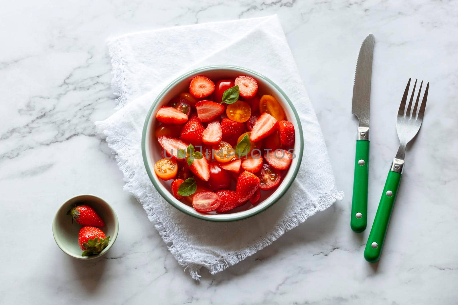 portion of tomato cherry and strawberry salad