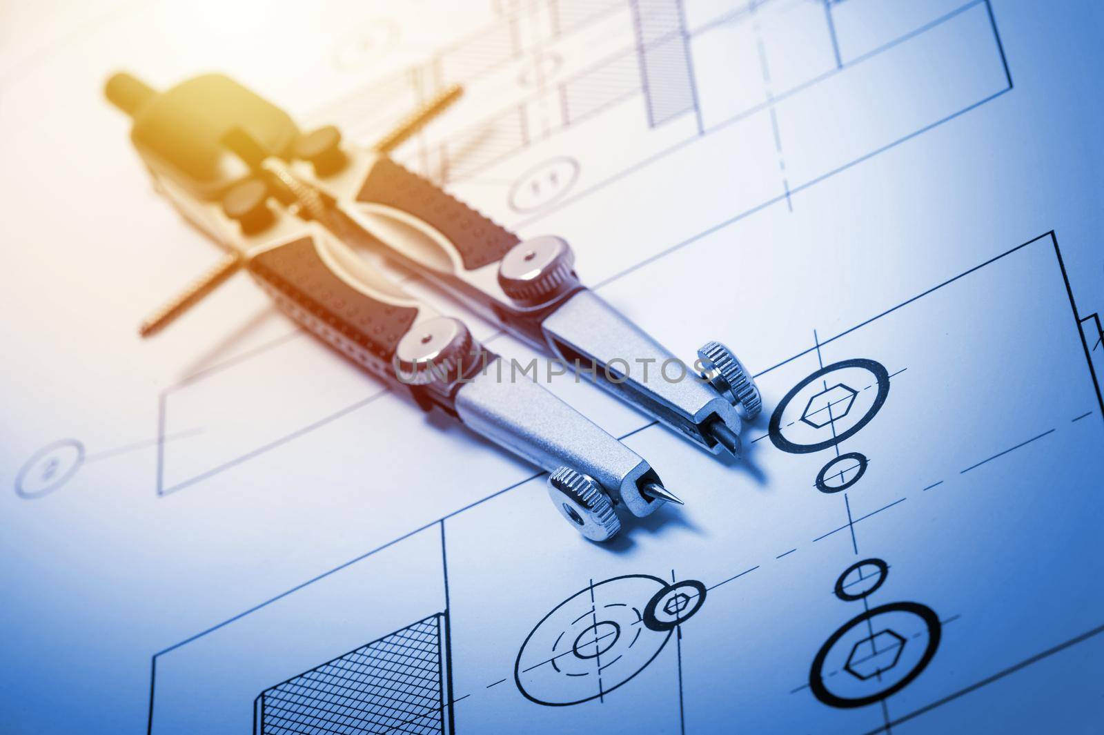 closeup compasses on the engineer's table, tool for industrial drawing