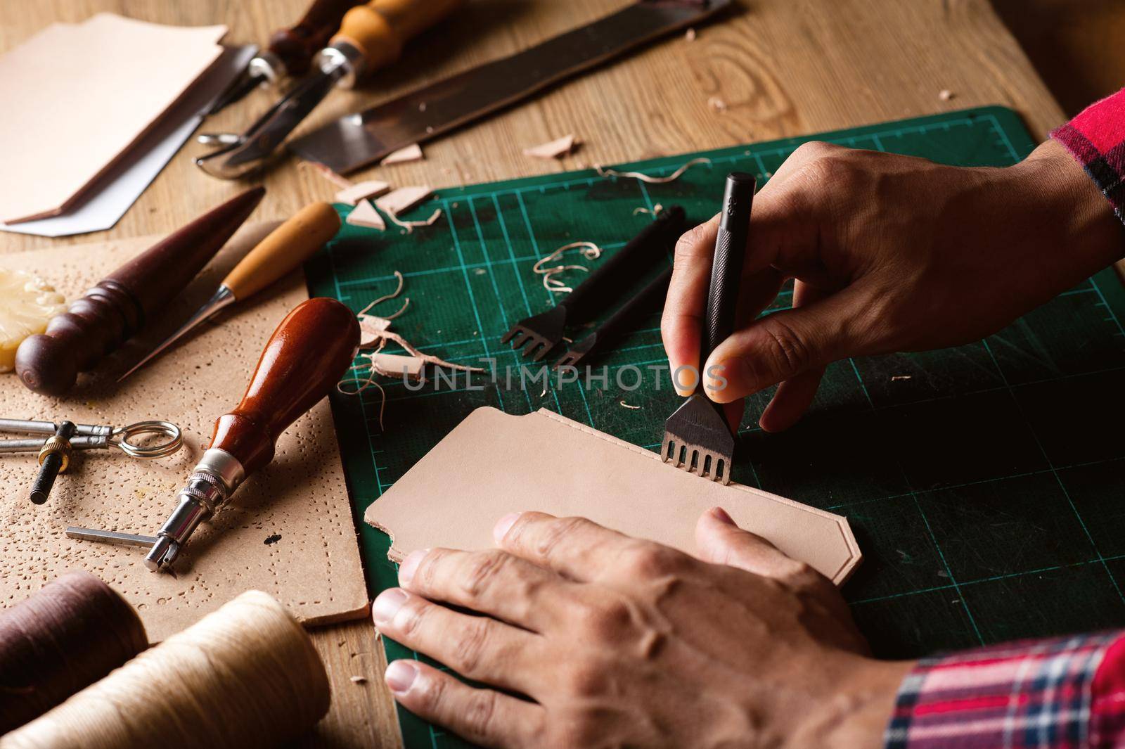 Working with vegetable tanned leather. Leather and the craft tools.