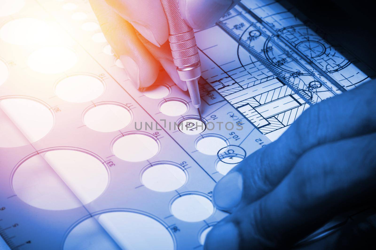 closeup technician's hand while using the industrial drawing tools, industrail drawing concept.
