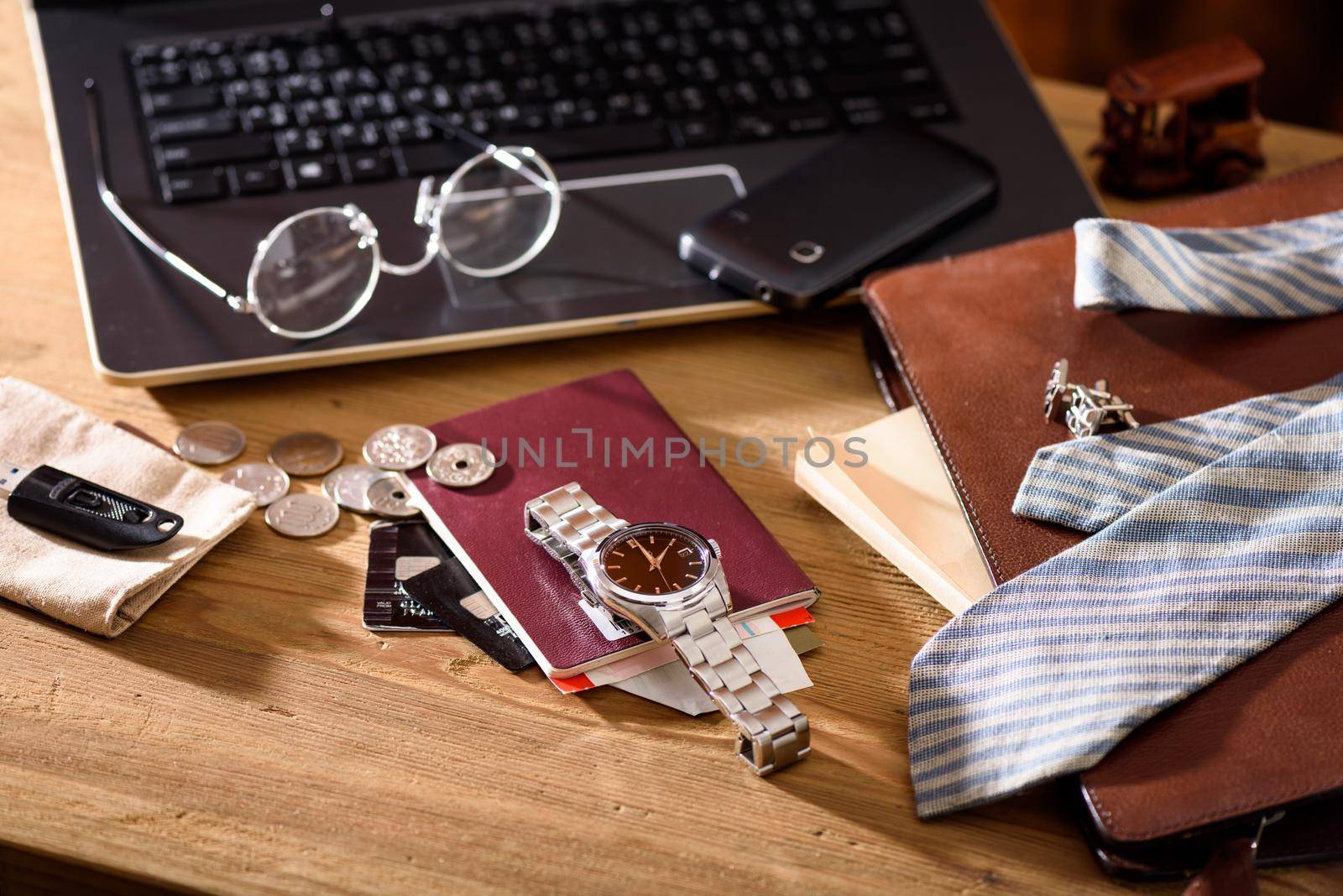 men's accessories, closeup at the luxury automatic wristwatch with black dial and stainless steel bracelet.