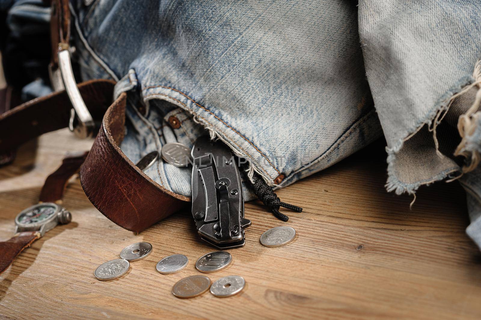 Pocketknife with old jeans in the background, pocketknife is one of every day carry (EDC) item for men.