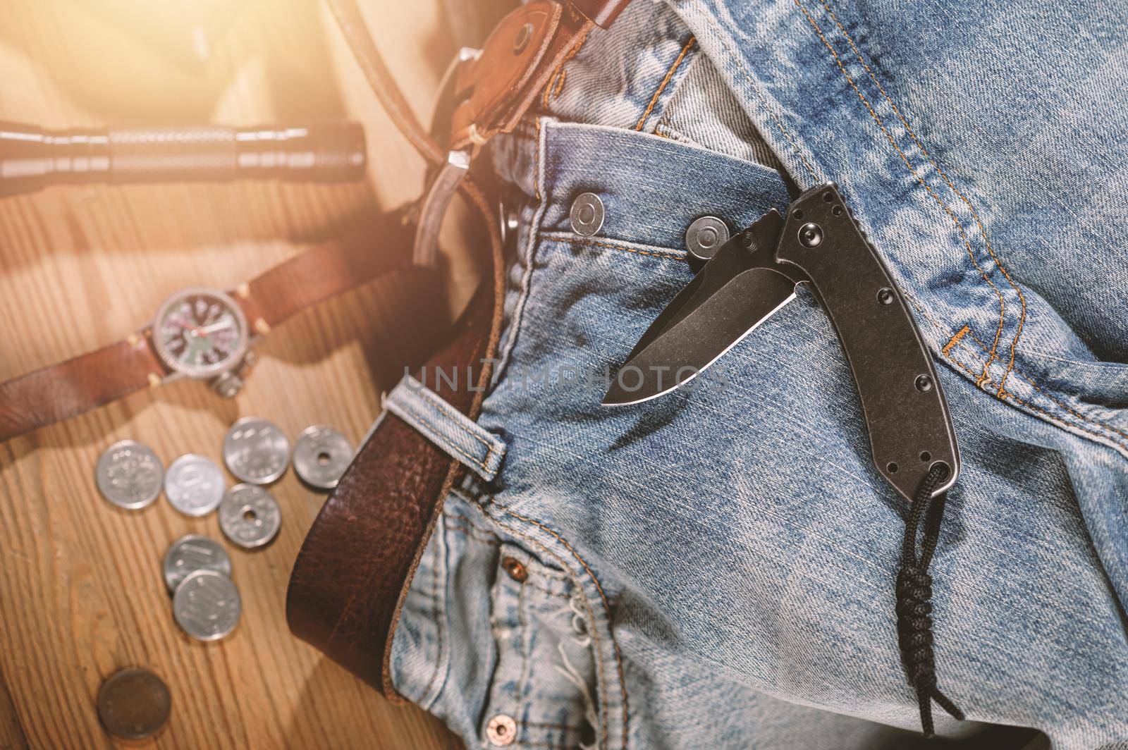 Pocketknife with old jeans in the background, pocketknife is one of every day carry (EDC) item for men.