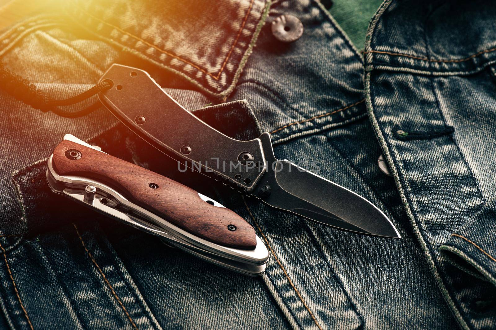 folding knife on denim by norgal