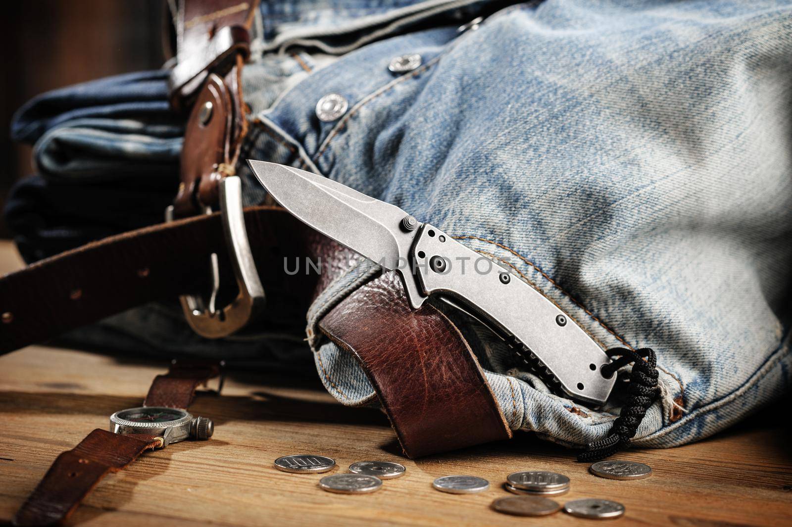 Pocketknife with old jeans in the background, pocketknife is one of every day carry (EDC) item for men.