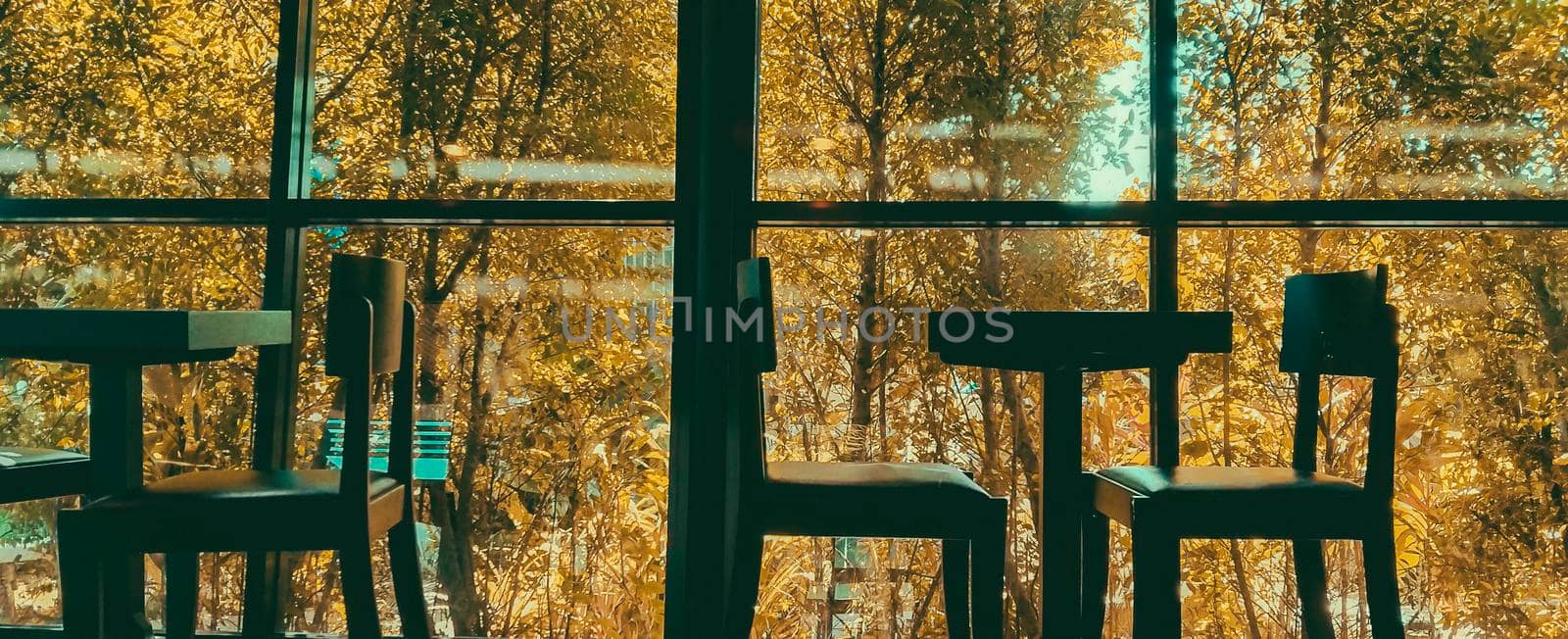 Empty seats in coffee shop restuarant by Petrichor