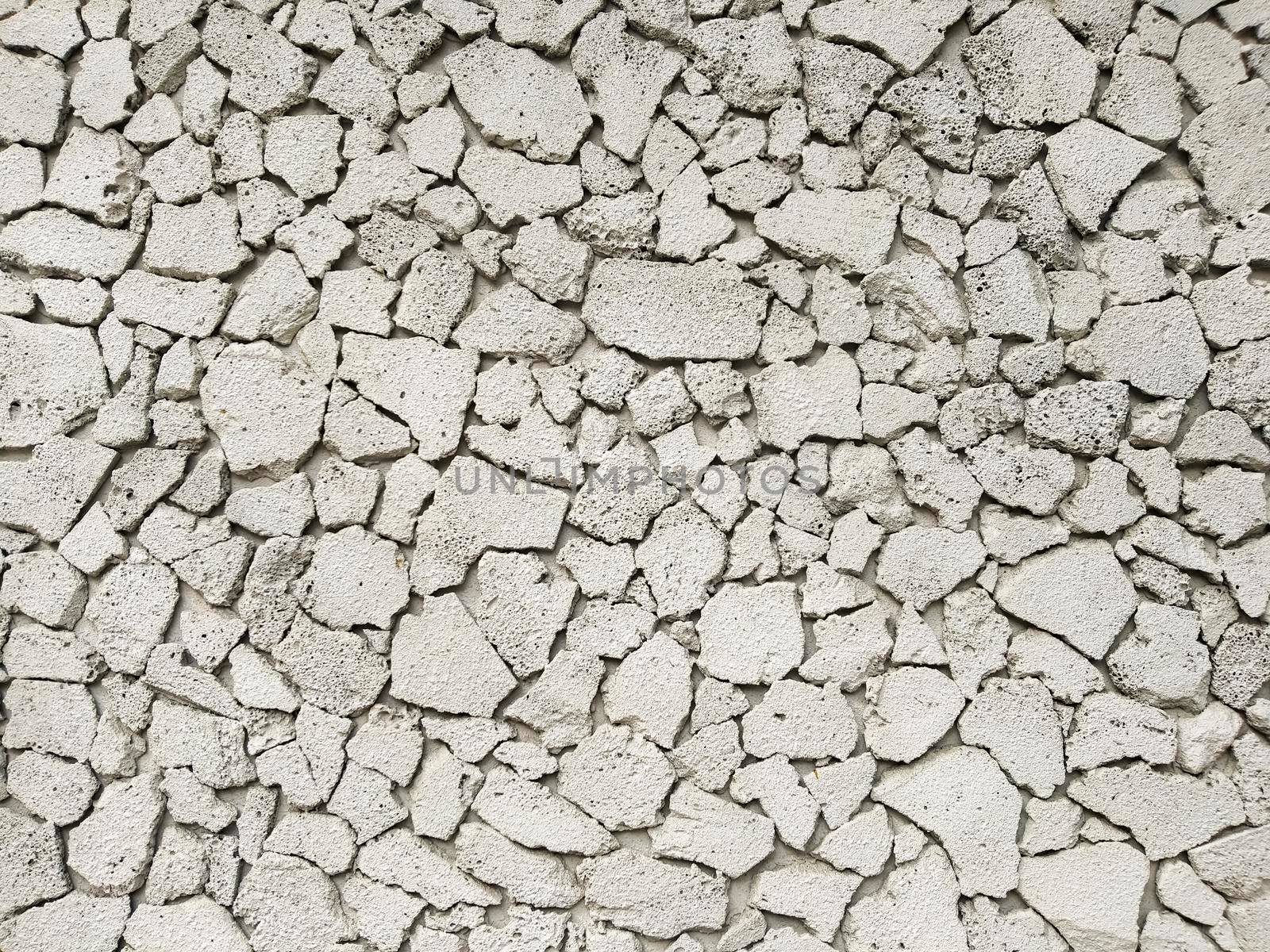 Texture of concrete in grey tone with cracked surface and dirt in cracks.old gray concrete wall for background. Concrete texture in white tone with very rough surface and large, deep cracks.