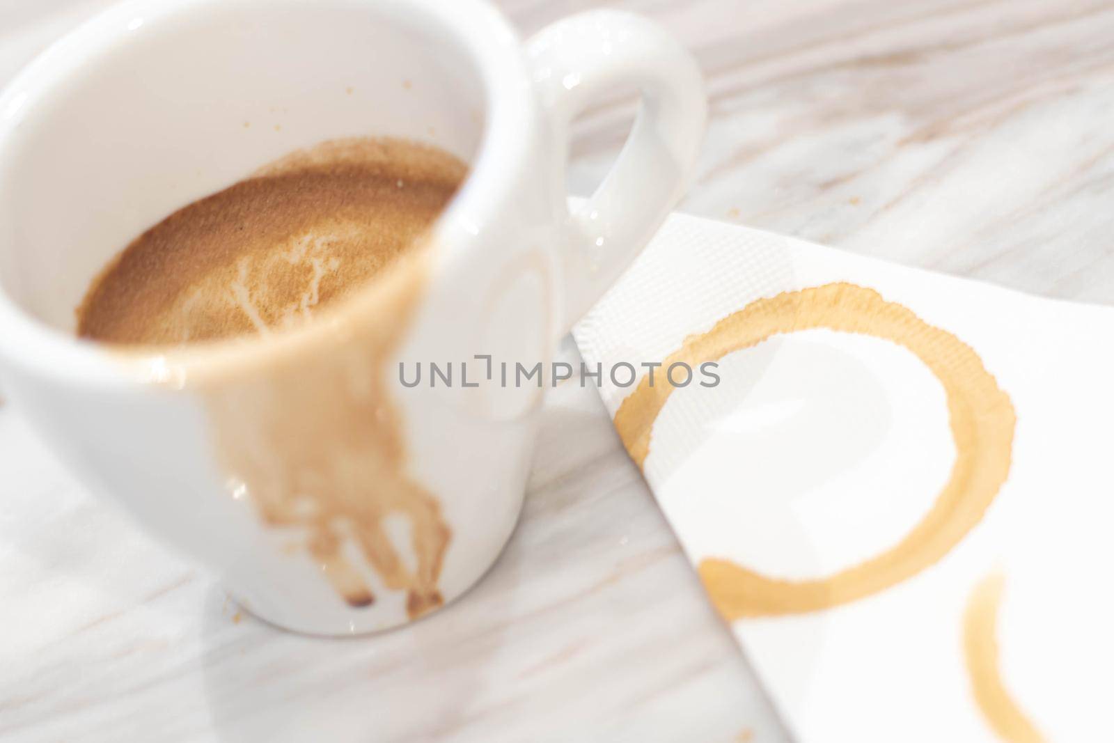 Dirty coffee white mug and Coffee mug stain on wooden plate.