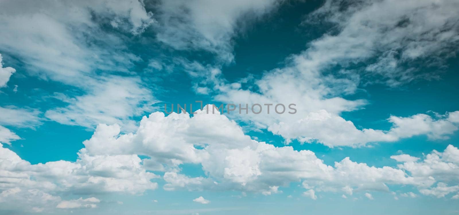 blue sky white fluffy clouds background . Beautiful blue sky and white cumulus clouds abstract background. Cloudscape background. Blue sky and fluffy white clouds on sunny.