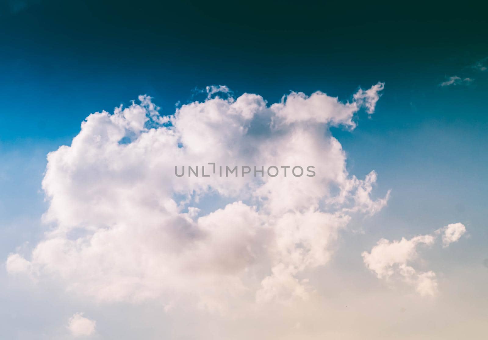 Fluffy White Clouds in A Blue Sky. Abstract background graphic design