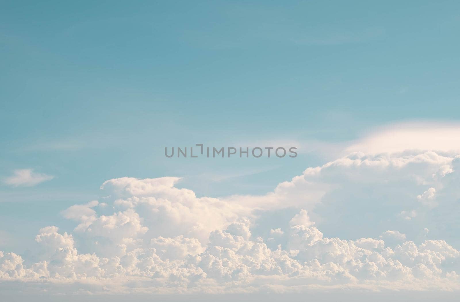 white fluffy cumulus cloud against blue sky abstract nature weather season background