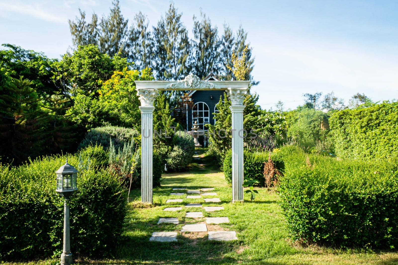 Stunning Entrance Portico Gate classic style decoration of a Public Garden. Column Stone structure element in classic architecture detail