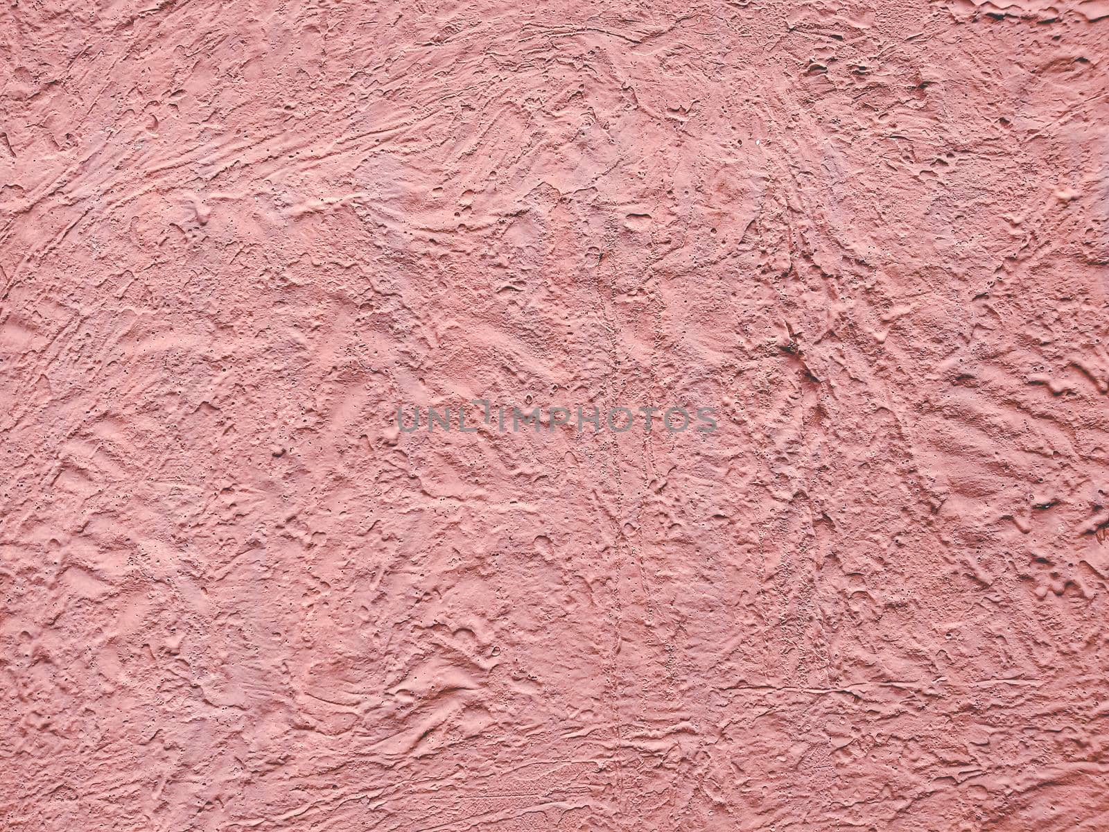 Pink textured stucco wall abstract background. Wall material in architecture and interior decoration idea.