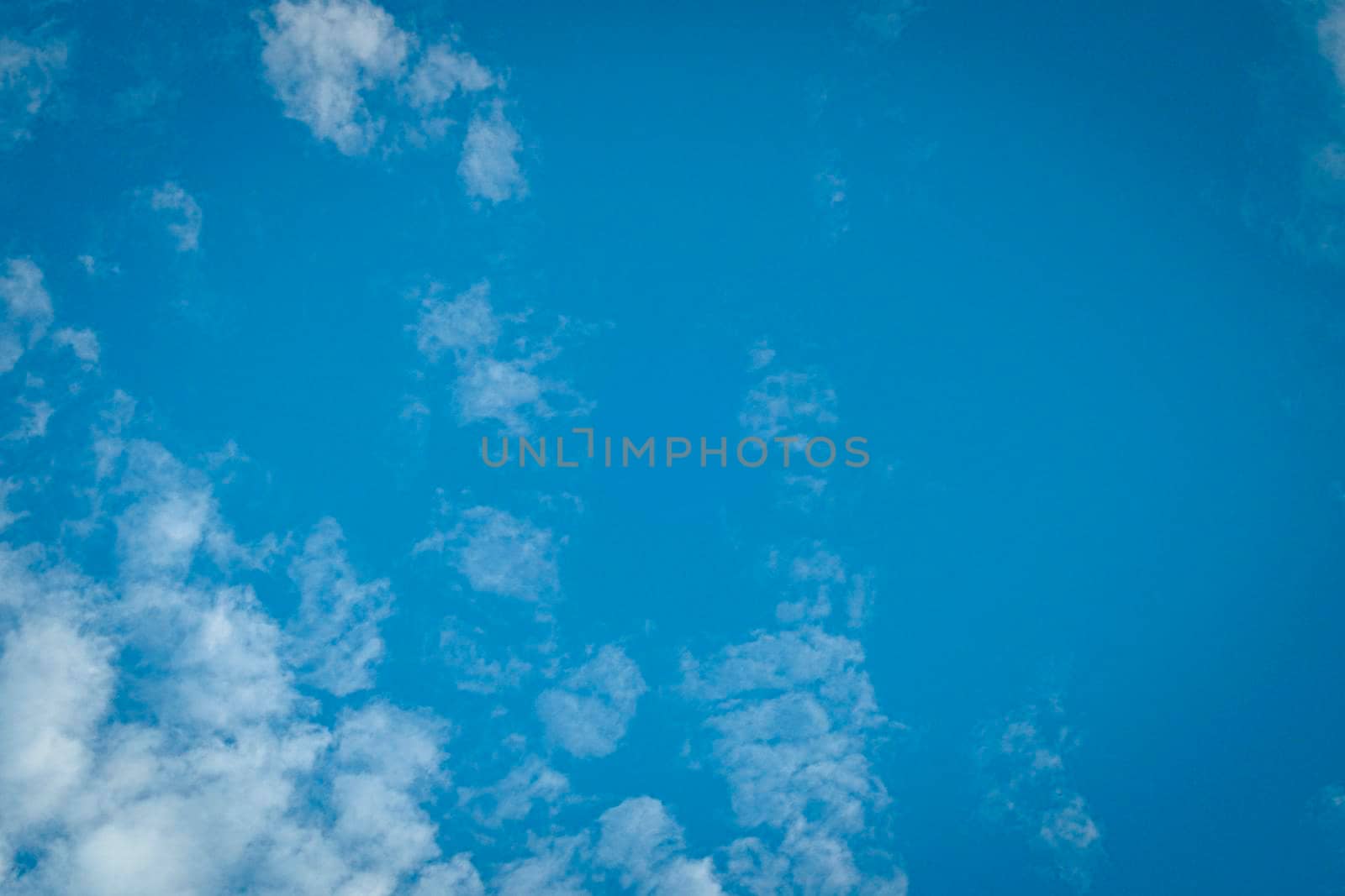 Blue Sky Background With White Clouds. Abstract season weather.