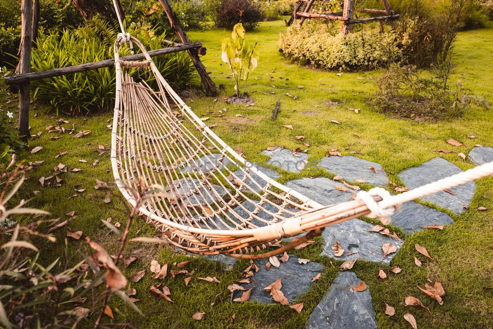 Bamboo Wicker Hammock Hanging On Tree For Relaxing In The Public Garden.