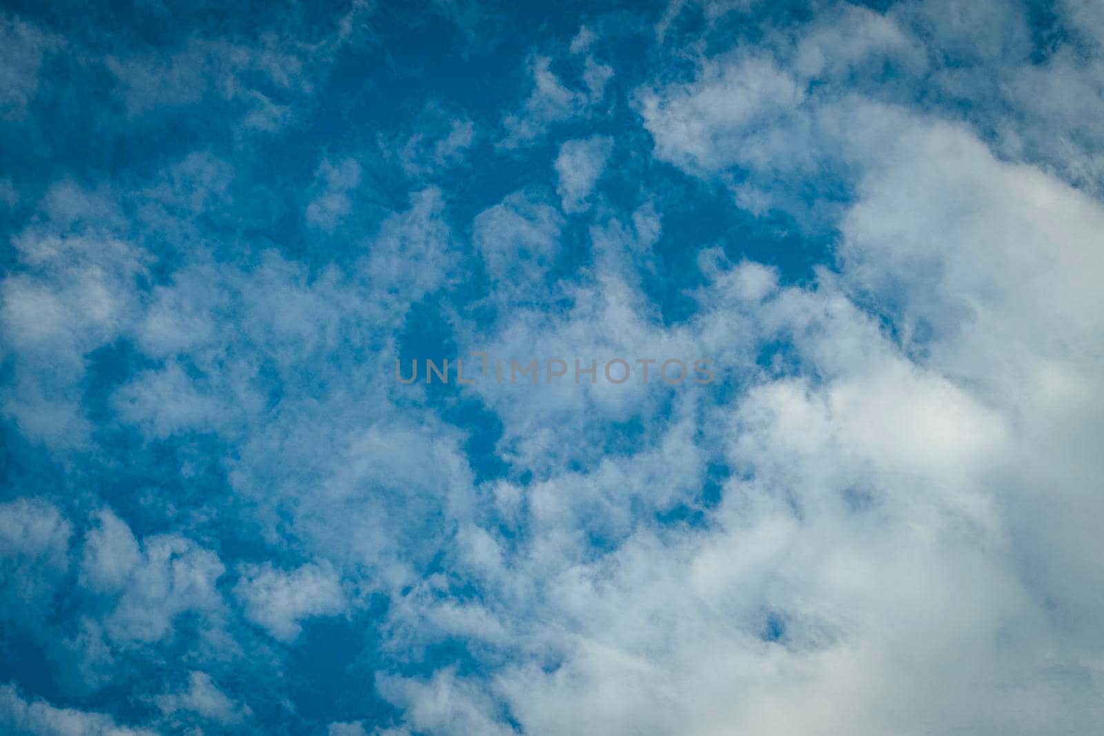 Blue Sky Background With White Clouds. Abstract season weather.