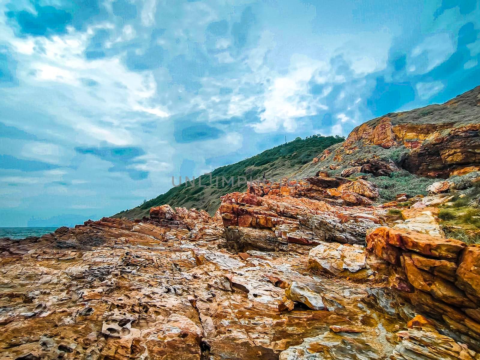 coast rock mountain at Khao Laem Ya National Park Rayong Thailand against blue sky background.