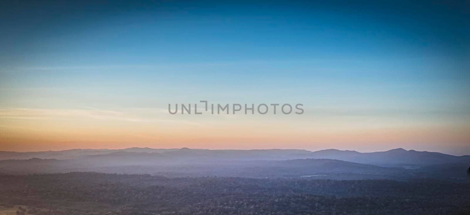 Panorama of a beautiful landscape with mountain ranges at sunset.  At Khao Yai National Park Thailand