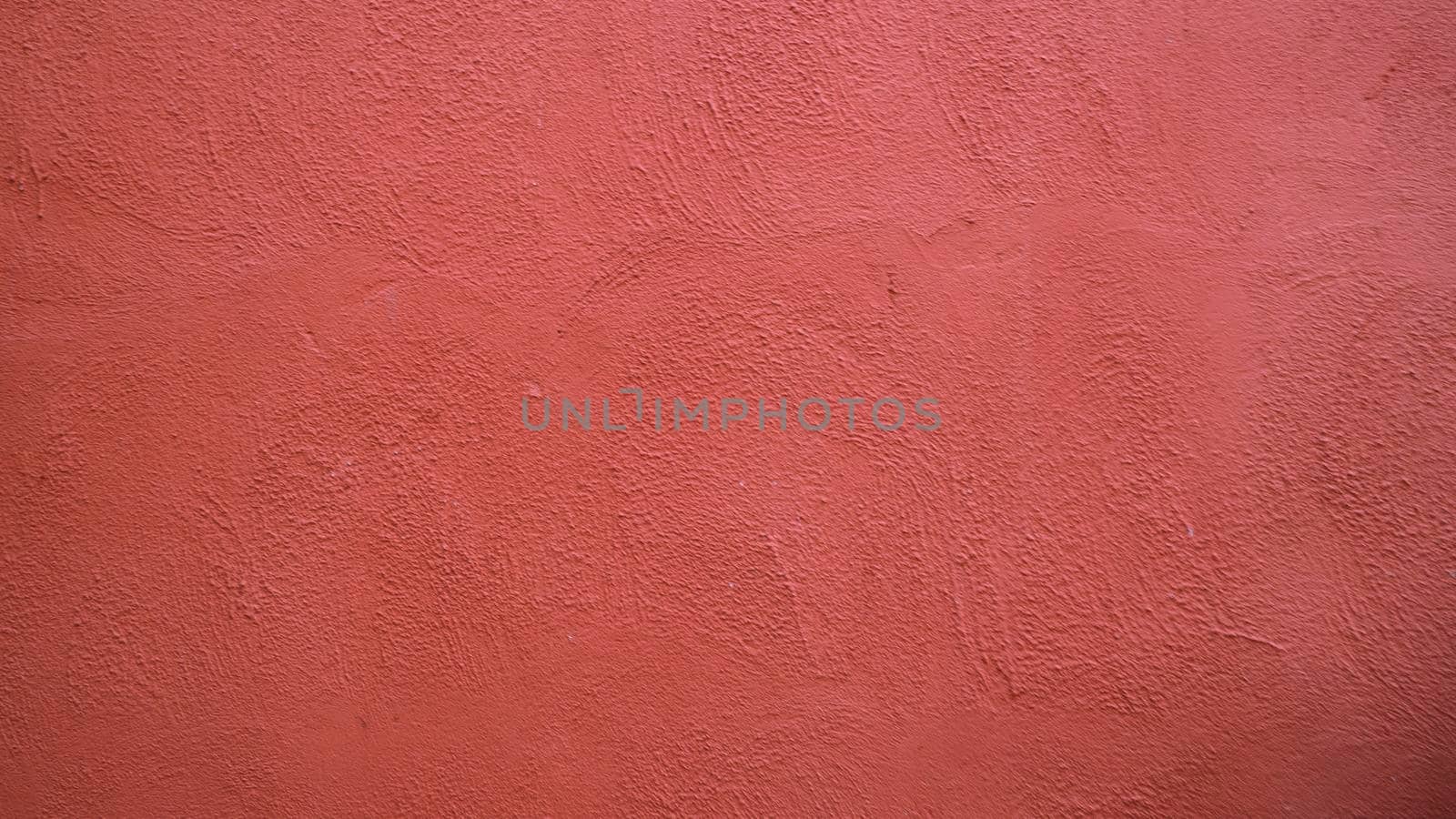 Abstract background from  red stucco concrete wall with sunlight, light and shadow