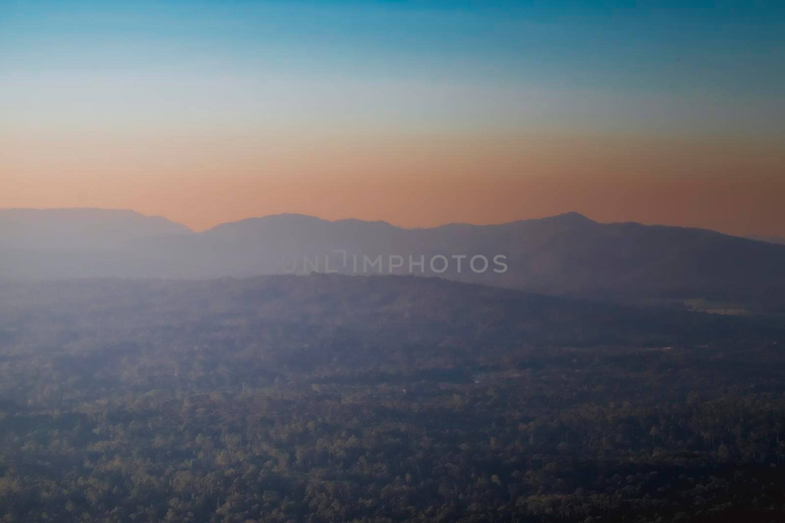 Panorama of a beautiful landscape with mountain ranges at sunset.  At Khao Yai National Park Thailand by Petrichor