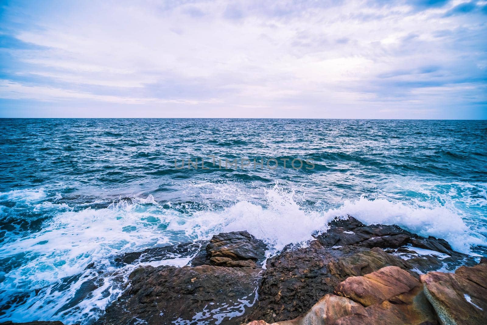 Sea with Smooth Wave and Rock landscape. Nature of Seascape in vacation holiday travel relax time.