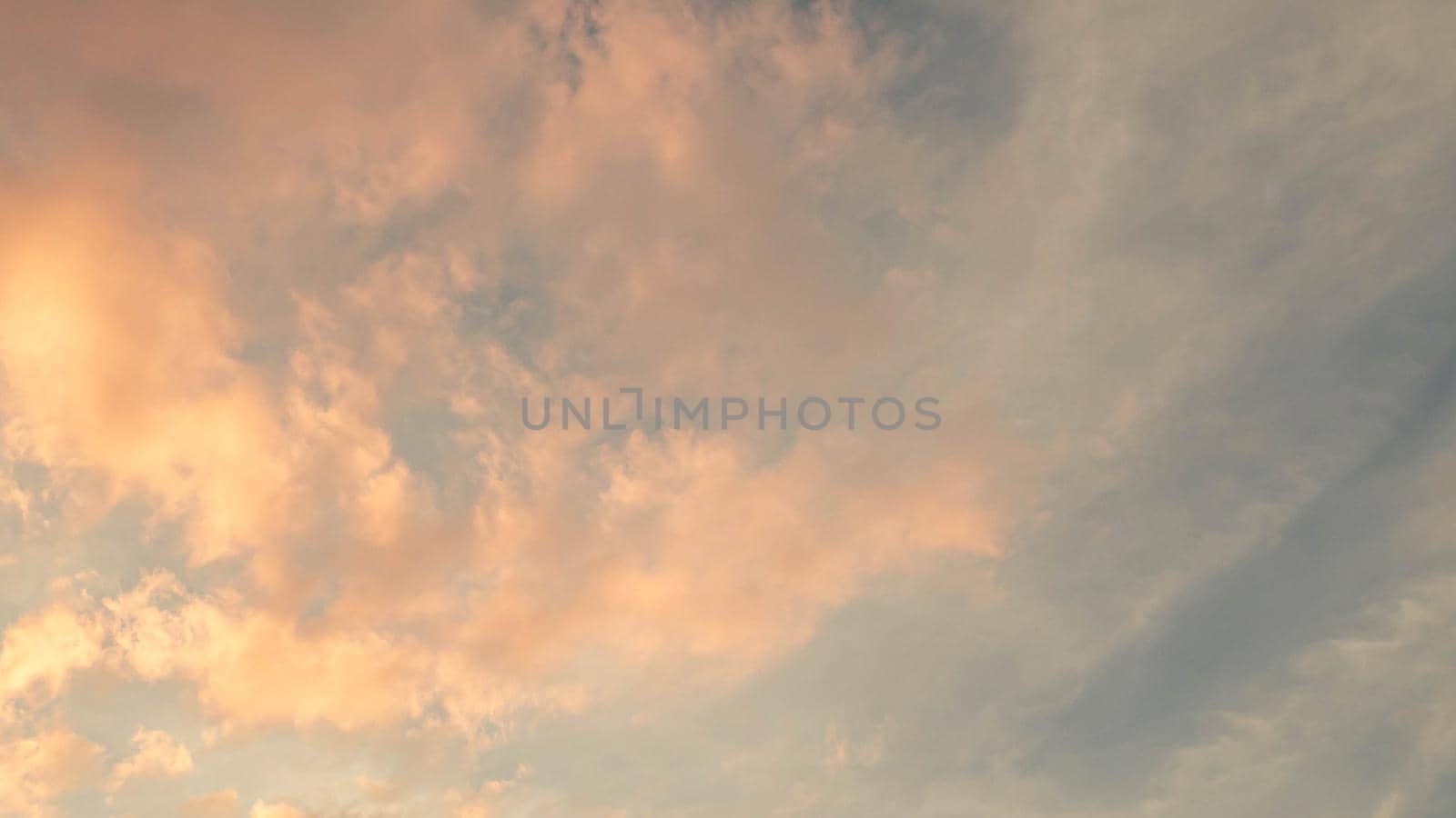 Dramatic clouds at sunset with cityscape silhouette. Abstract season weather vacation time.