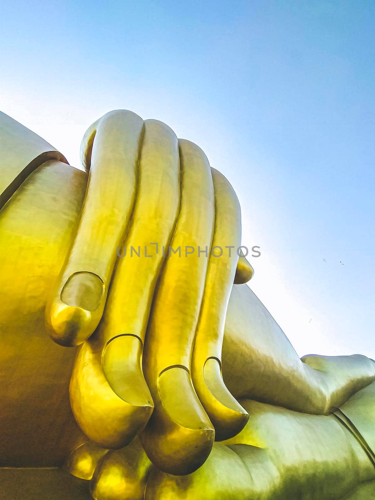 Close up Big hand of The golden Buddha statue at the Wat Muang Angthong Thailand