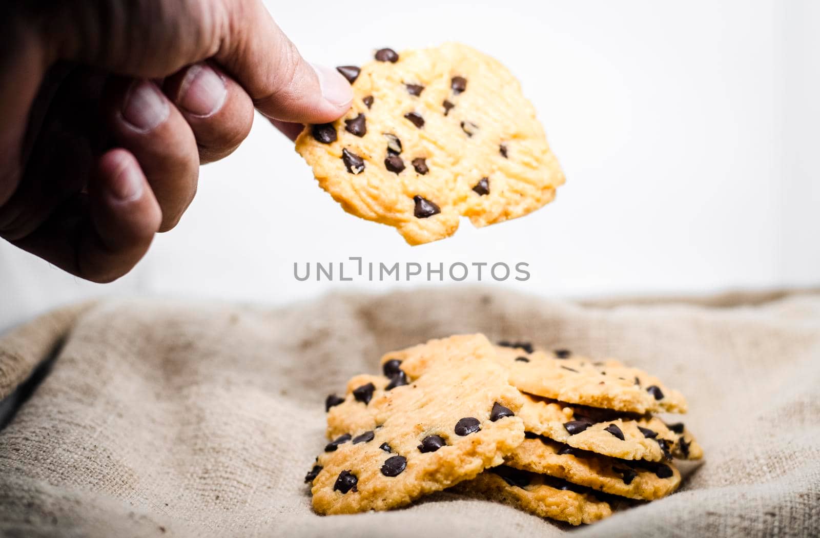 hand take a Chocolate Chip Cookie Bakery Cheesecake Baking sweet food snack object still life