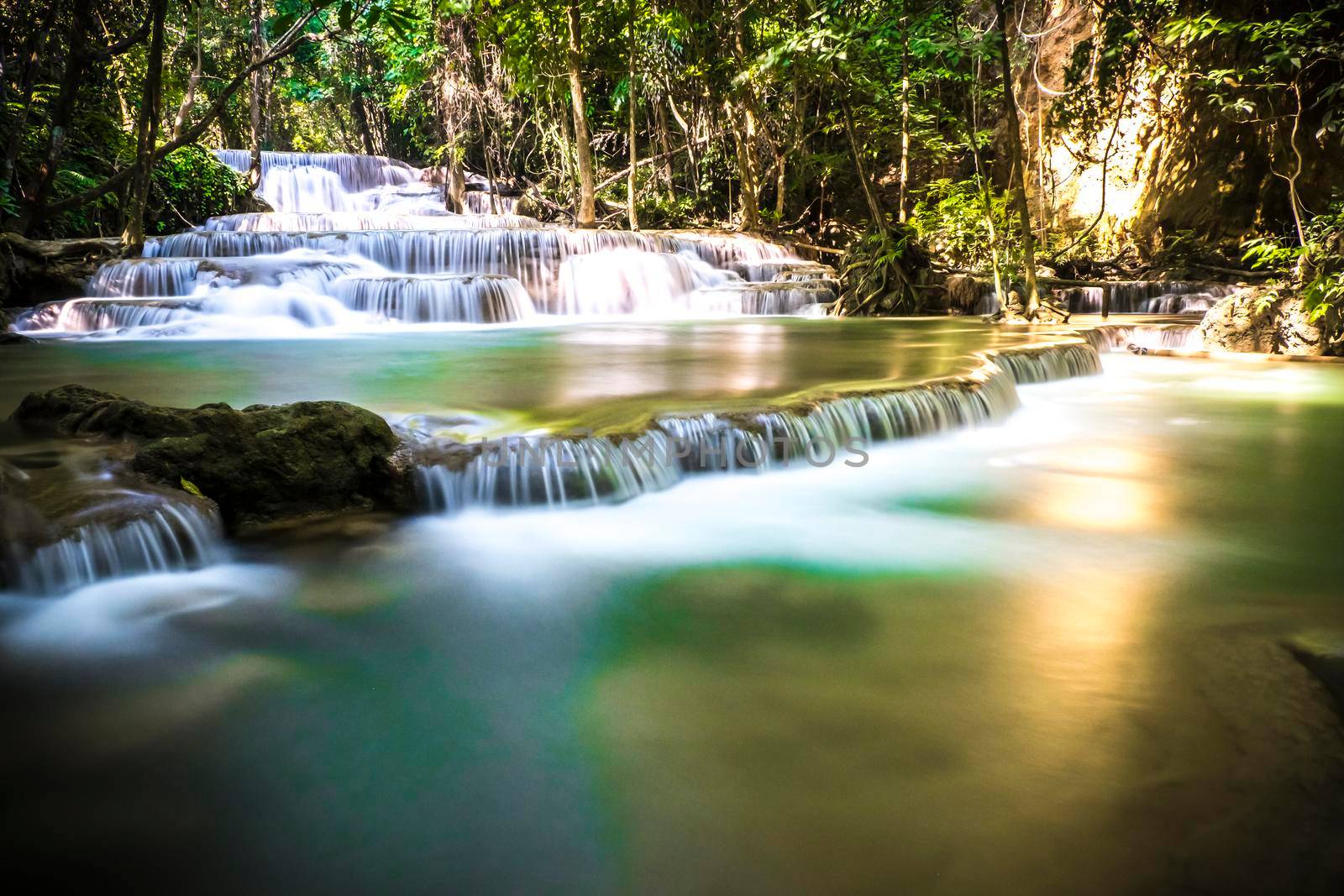 Long exposure of Huay Mae Khamin Waterfall in Srinakarin Dam National Park. Kanchanaburi Thailand. cascade waterfall tropical forest