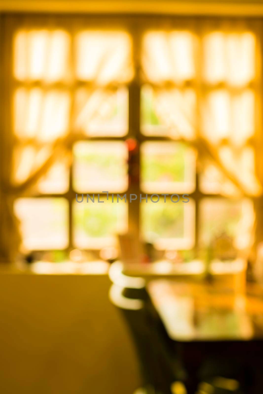 Blurred background of Warm morning sunlight through window summer idea