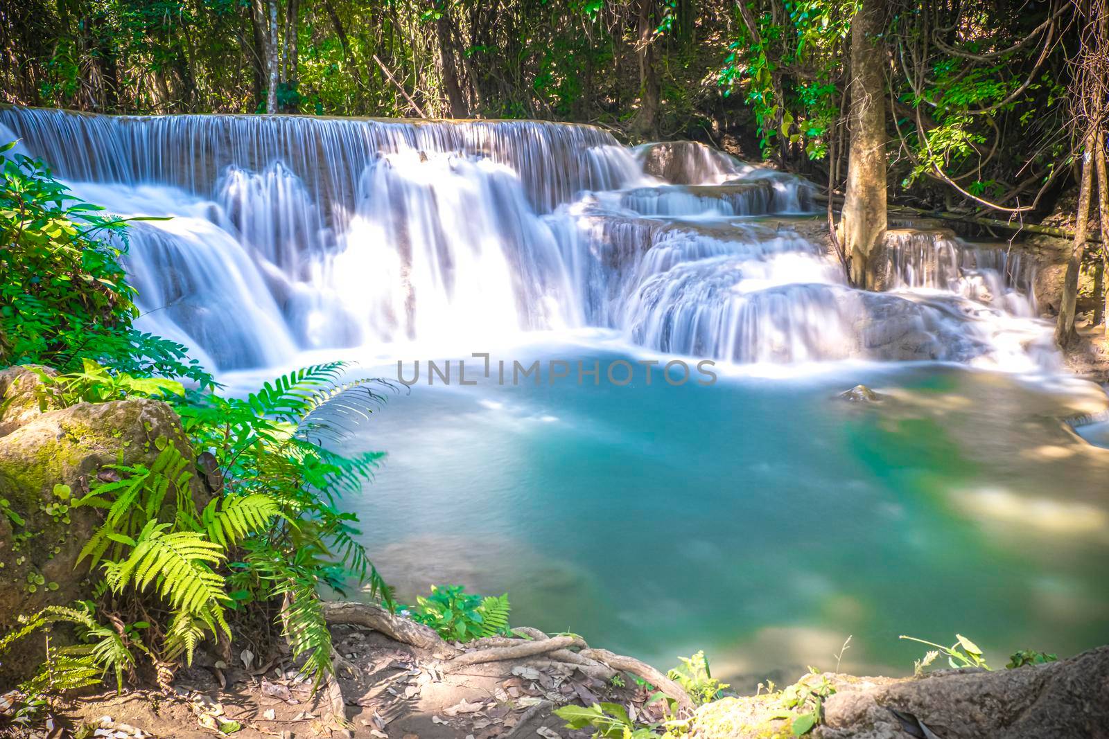 Long exposure of Huay Mae Khamin Waterfall in Srinakarin Dam National Park. Kanchanaburi Thailand. cascade waterfall tropical forest
