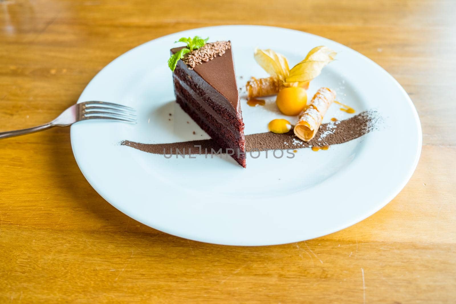The Perfect Chocolate Cake. Slice of delicious chocolate cake decoration with fruit