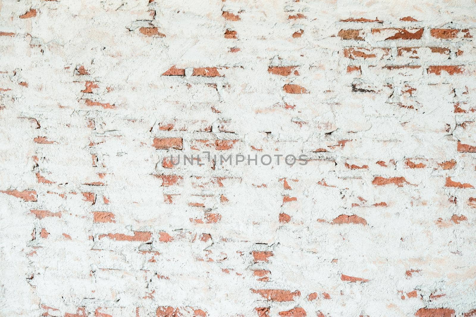 Old chipped white brick wall texture background. Vintage Wide Old Red White Brick Wall Texture Background. whitewashed grungy brick wall, abstract red white vintage background