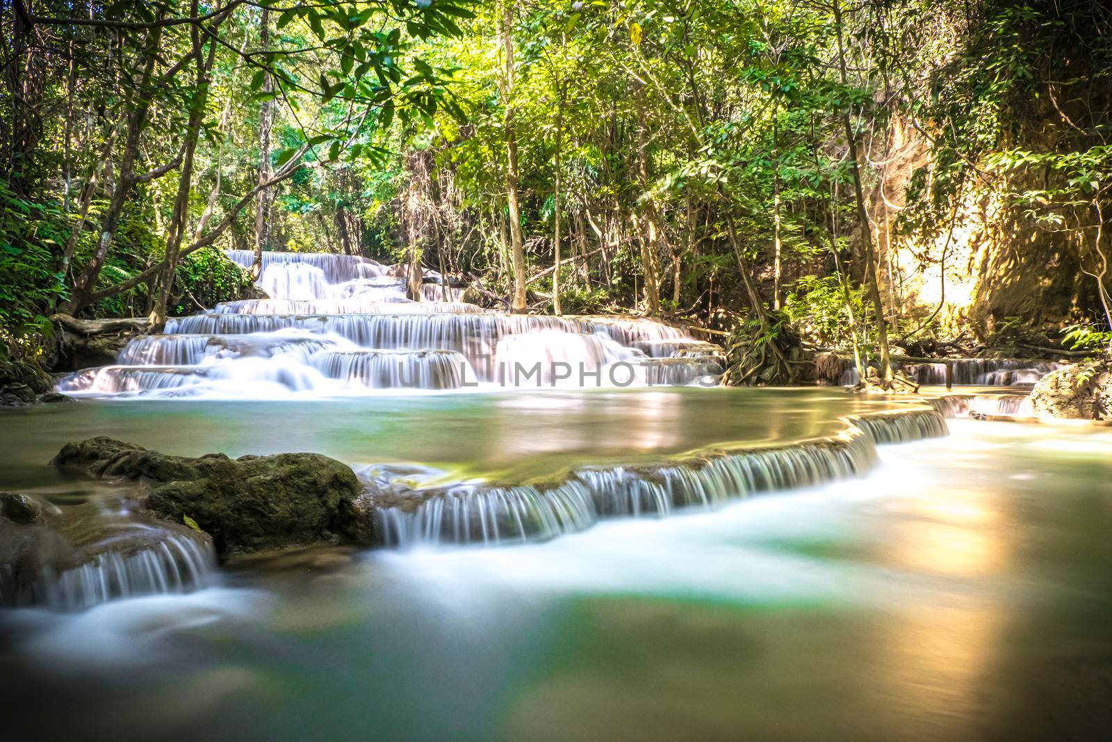 Long exposure of Huay Mae Khamin Waterfall in Srinakarin Dam National Park. Kanchanaburi Thailand. cascade waterfall tropical forest