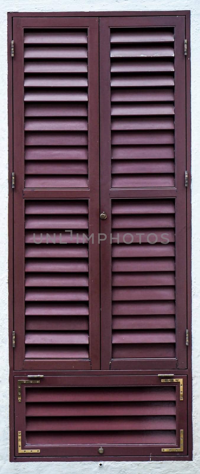 Old wooden vintage louver window. Blinds Window Shutter Plantation Shutter in brown.