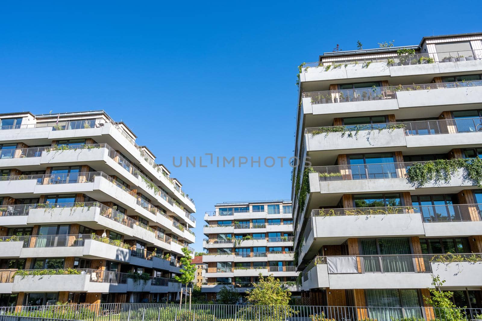 Modern apartment buildings with a concrete facade by elxeneize