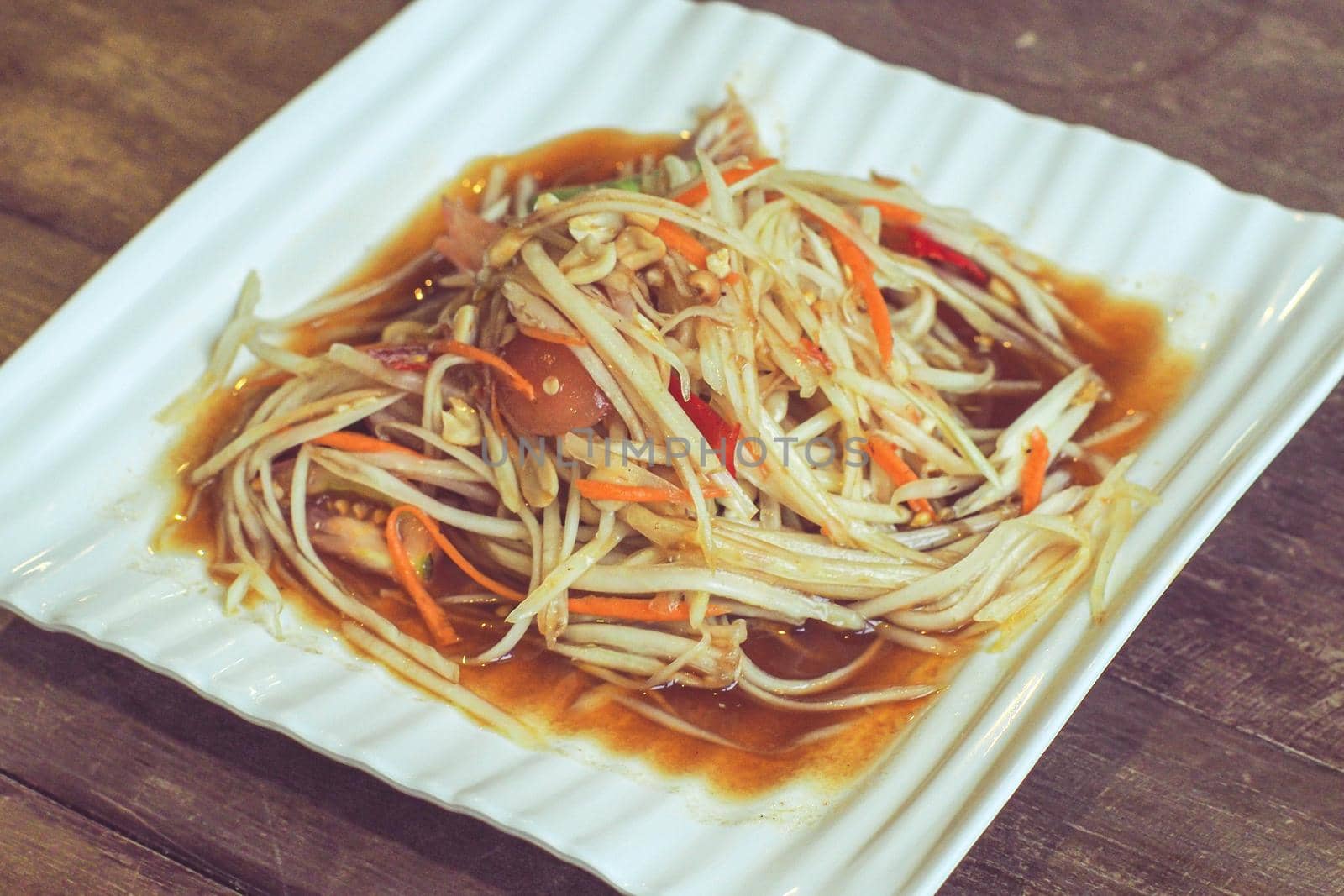 Som tum Thai best dish is vegetarian papaya spicy salad food in Thailand. Ingredient are vegetable lemon tomato papaya lime shrimp.