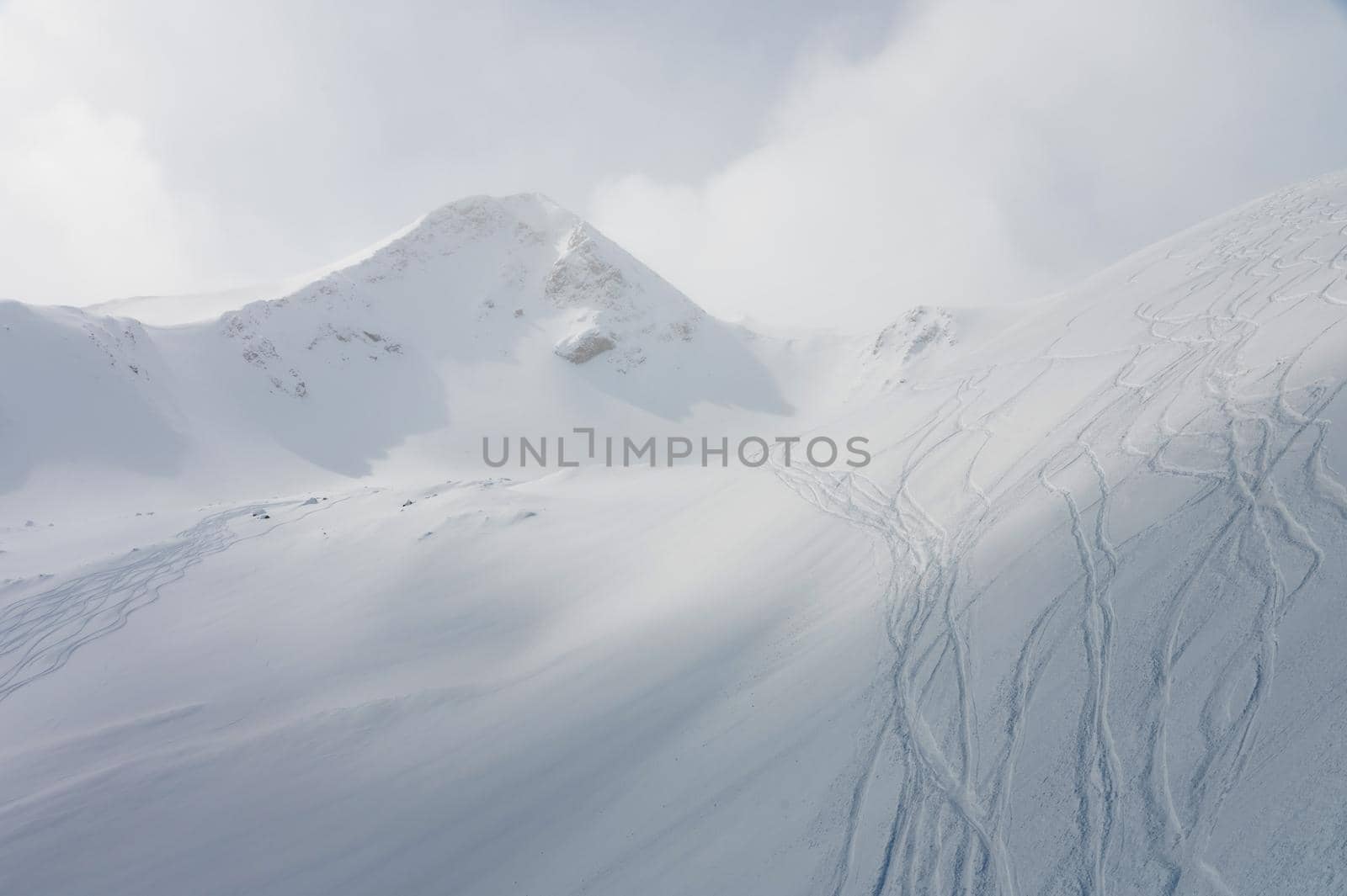 Snowy mountains and blue sky. Caucasus Mountains, Georgia, ski resort Gudauri