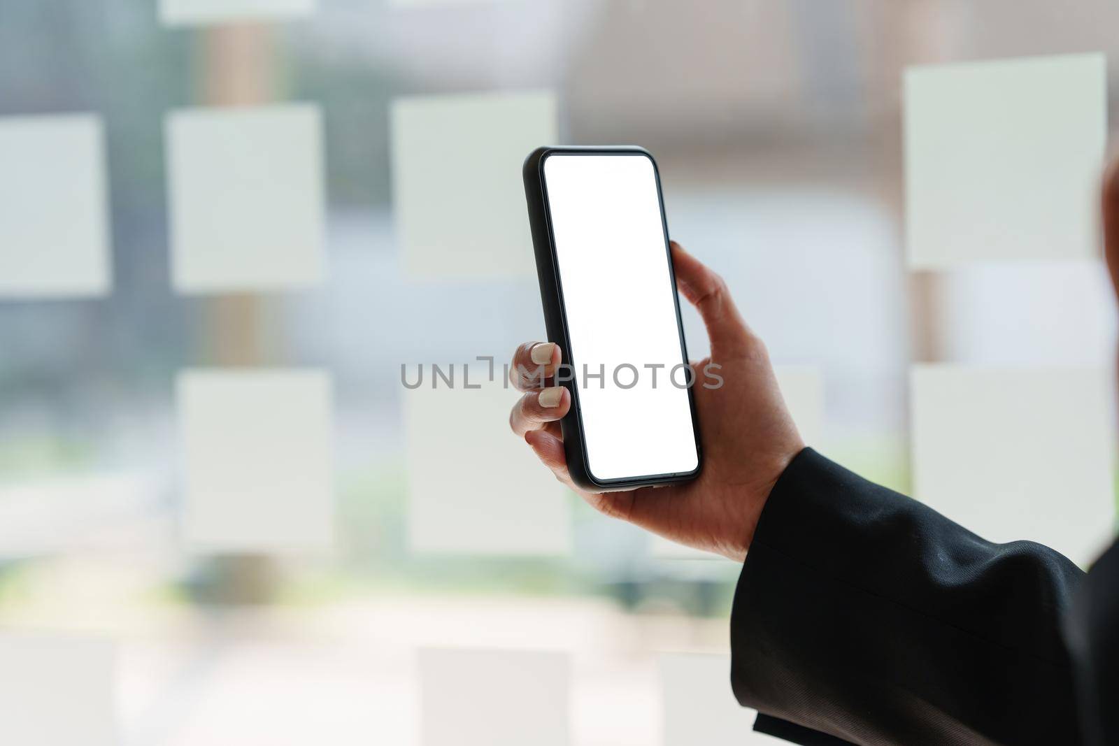 A Woman excited surprise and showing cell phone screen. Blank screen for your advertising